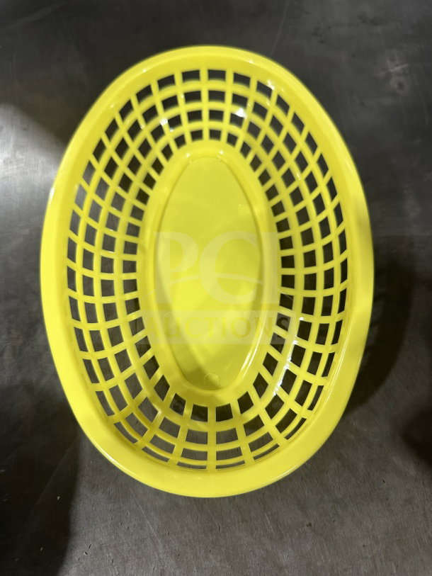 Brand new yellow Table Craft commercial food basket, model 1074Y. Durable plastic, oval shape, grid design. 3 dozen in box.