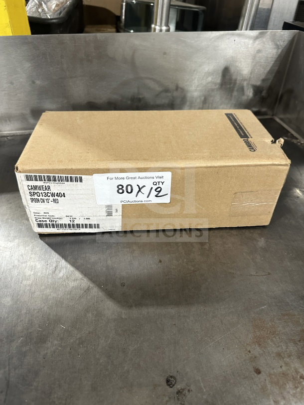 Box of 12 brand new Camwear 13" red plastic spoons, model SPO13CW404, unopened.
