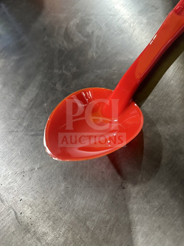 Brand new Camwear 13" red plastic spoon, model SPO13CW404, in pristine condition.