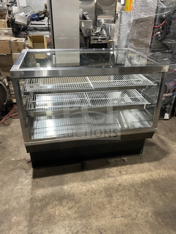 Commercial square glass refrigerated bakery/deli display case with poly coated wired racks, electrical powered, excellent condition.