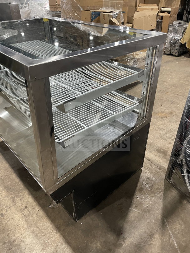 Commercial square glass refrigerated bakery/deli display case with poly-coated wired racks, in excellent condition.
