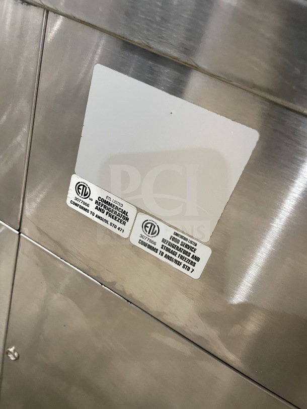 Commercial square glass refrigerated bakery/deli display case with electrical power and poly-coated wired rack. Features ETL certification labels.