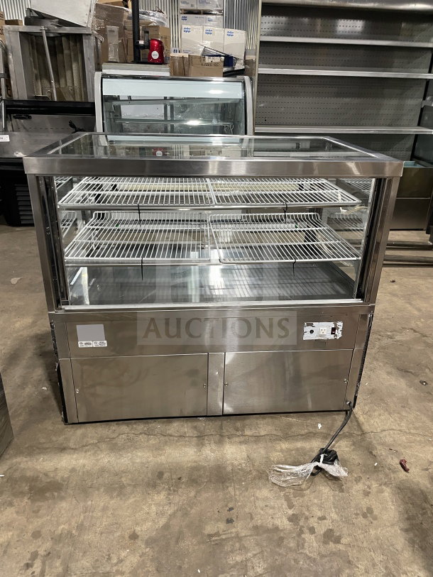 Commercial square glass refrigerated display case with electrical powering, poly coated wired racks. Suitable for bakery/deli.