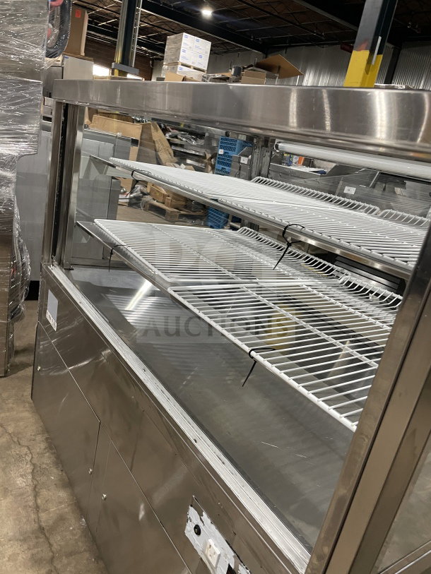 Commercial square glass full-service refrigerated bakery/deli display case with poly-coated wired racks. Electrical powered.