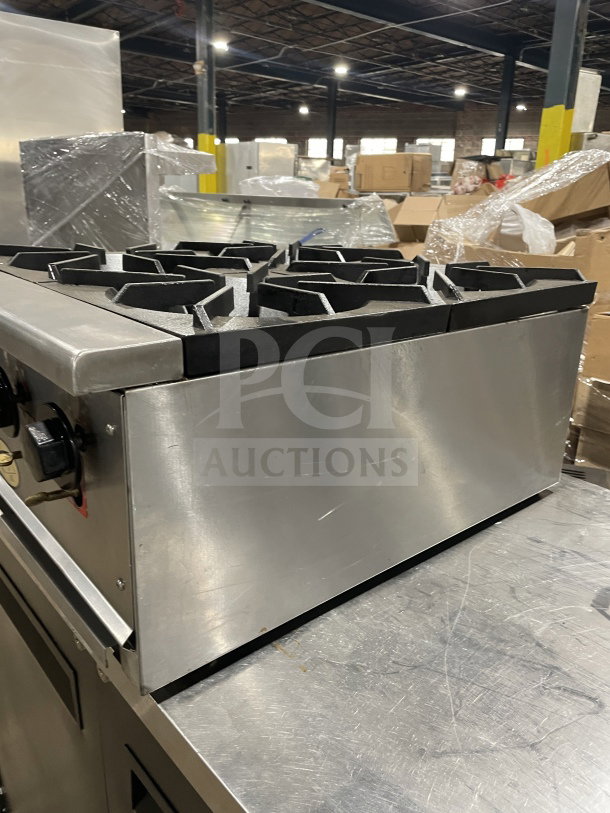 L&J Brands stainless steel 4-burner gas hot plate, commercial countertop model, excellent condition, with control knobs.