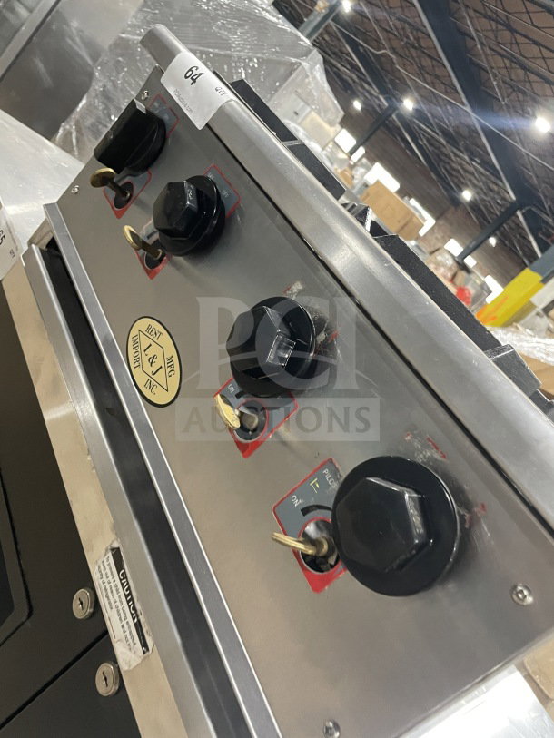 L&J Brands stainless steel 4-burner gas-powered countertop hot plate. Features control knobs, good condition. Model label visible.
