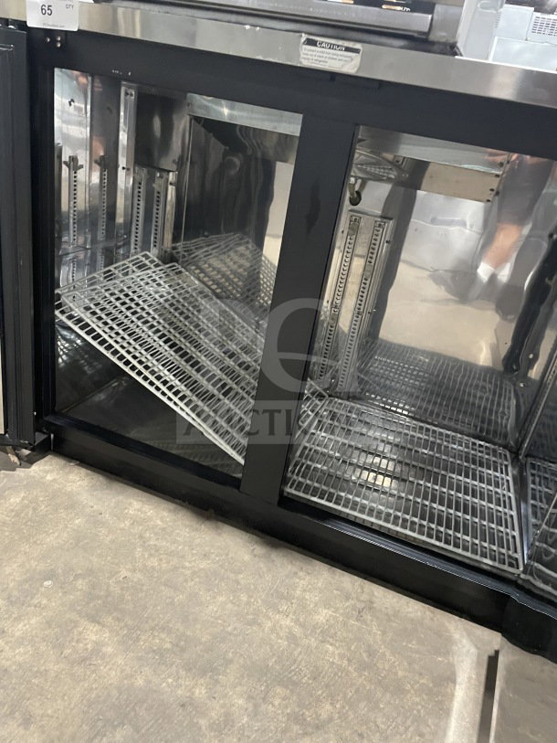 Turbo Air TBB-2SB 2-Door Bar Back Cooler with stainless steel worktop, poly-coated rack, black exterior. Model SN: BB 20503014.
