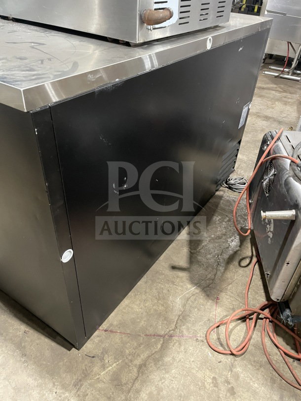 Turbo Air TBB-2SB black 2-door bar back cooler with stainless steel worktop and poly coated wired rack, serial BB 20503014.