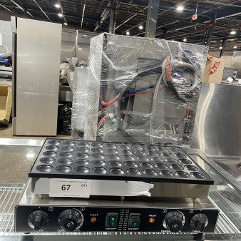 Commercial electric 50-hole mini pancake maker with adjustable temperature settings. Model in excellent condition.