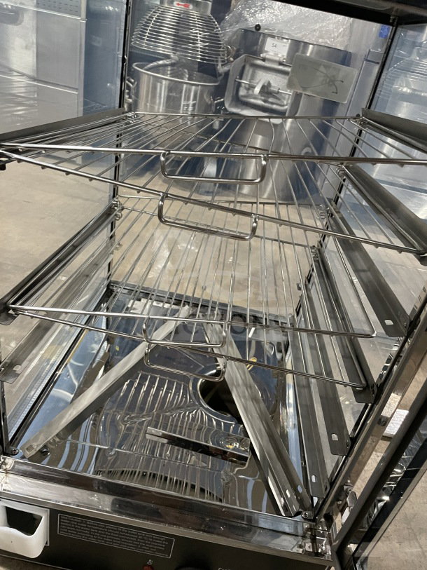 Commercial tabletop food steamer, model ESTC-16, with glass and chrome-plated wire rack. Electric-powered, countertop design.