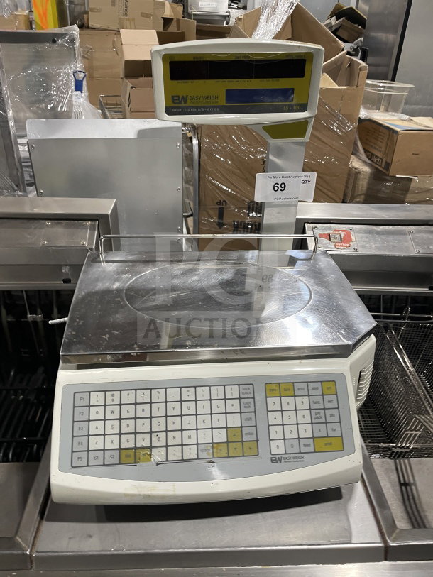 Easy Weigh LS-100 digital scale, commercial countertop model, serial LS01150443, 85/240V, with keypad and display.