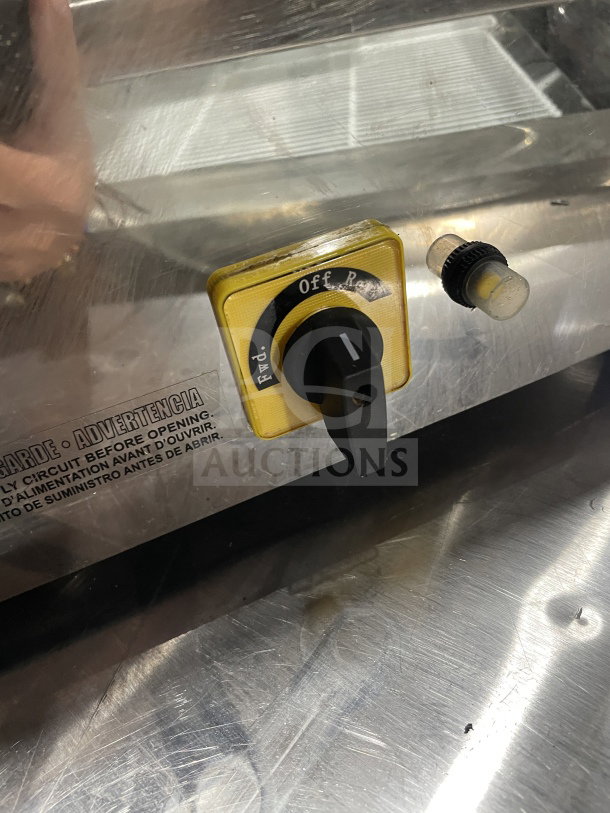 Skyfood SMG22F meat grinder, showing power switch. Heavy-duty electric, stainless steel, commercial-grade condition.
