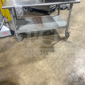 Commercial stainless steel two-compartment equipment stand on casters, maintained condition, includes shelf, visible label "23 QTY".