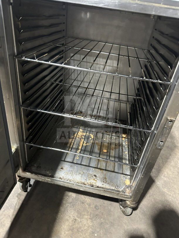 Alto Shaam 1200S stainless steel holding cabinet on casters; electric; interior shows wear; suitable for commercial use.