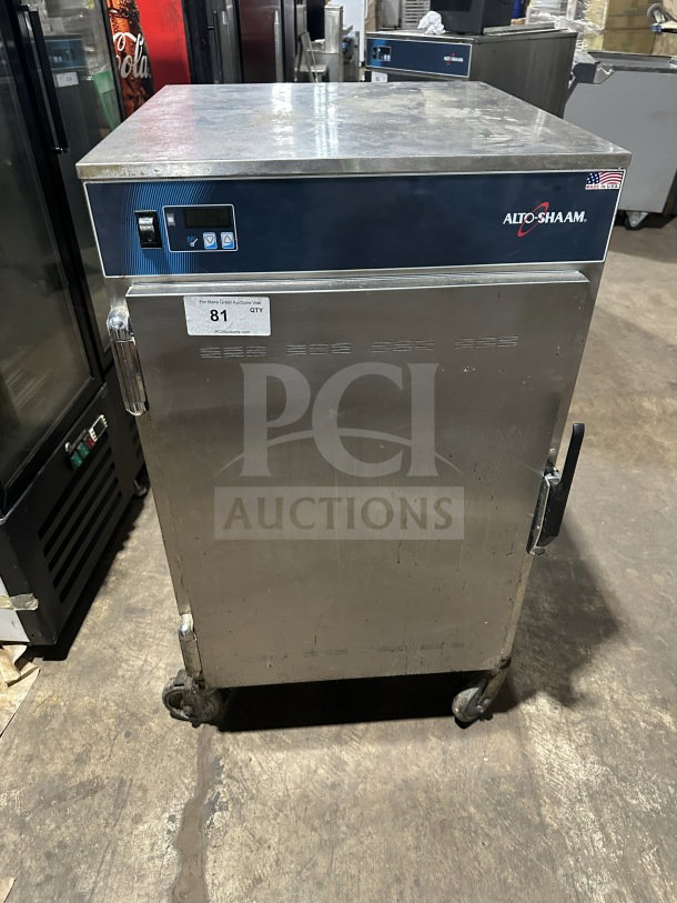 Alto Shaam 1200S stainless steel electric holding cabinet, model number 1200S, showing control panel and wheels, SN: M10673352021, 120V.