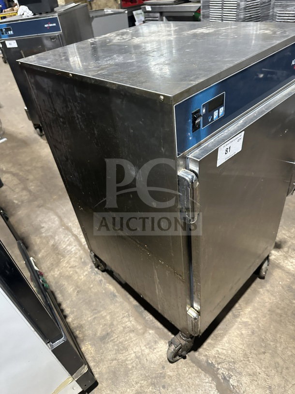 Alto Shaam 1200S electric Halo Heat holding cabinet in stainless steel, commercial-grade, on casters, slight surface wear.