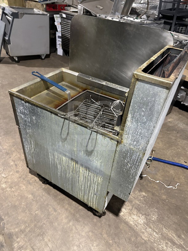 Pitco 65C+ Stainless Steel Natural Gas Deep Fat Fryer, with back splash and basket, on casters, SN: G17HC052060.