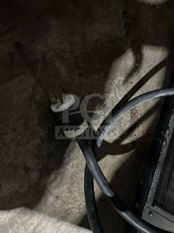 Close-up of the power cord for a Scotsman Prodigy Plus ice machine, model C0522SA-32B, showing a three-prong plug.