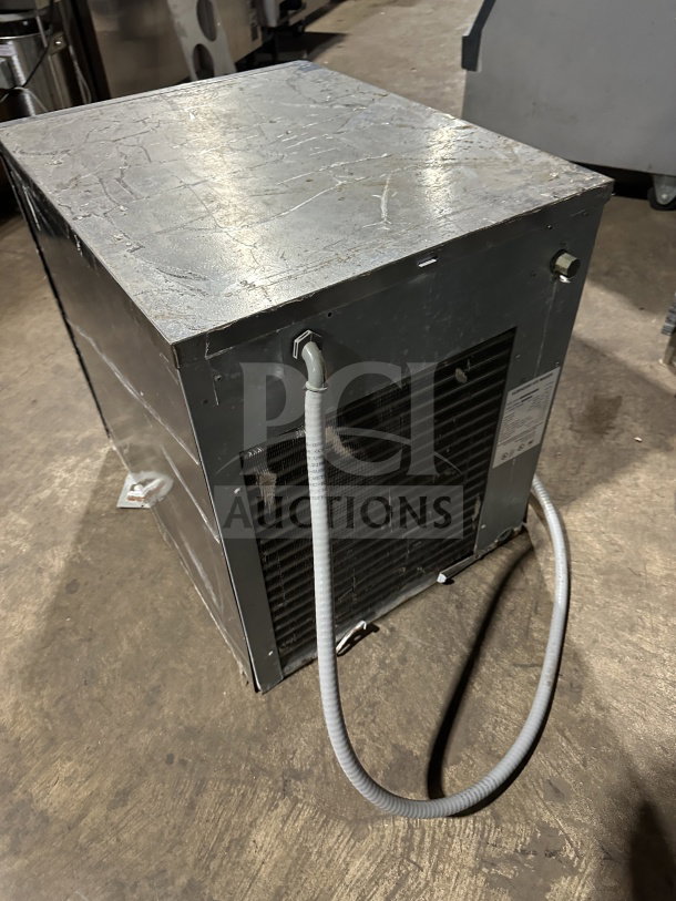 Hoshizaki stainless steel modular ice machine head, electric powered, visible wear, cooling vents, attached conduit cable.