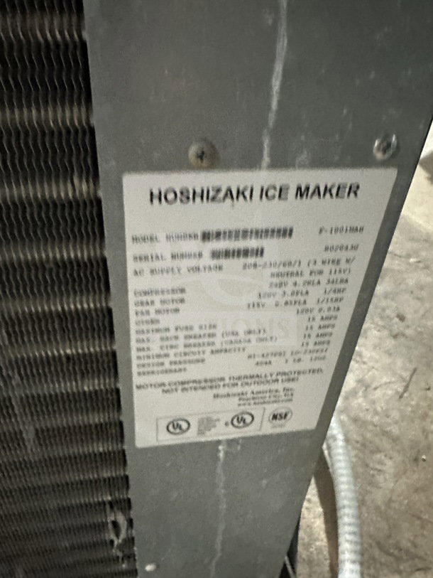 Hoshizaki commercial stainless steel ice machine head with visible model and serial number label, showcasing specifications.