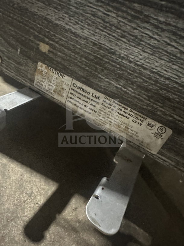 Alt text: Crathco CS4E 2D 3D16 beverage dispenser label showing model, serial number T458048, and electrical details.