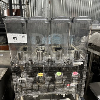 Crathco 2019 commercial countertop 4-hopper beverage dispenser, model CS4E/2D/3D16, with clear poly jugs and stainless steel body.