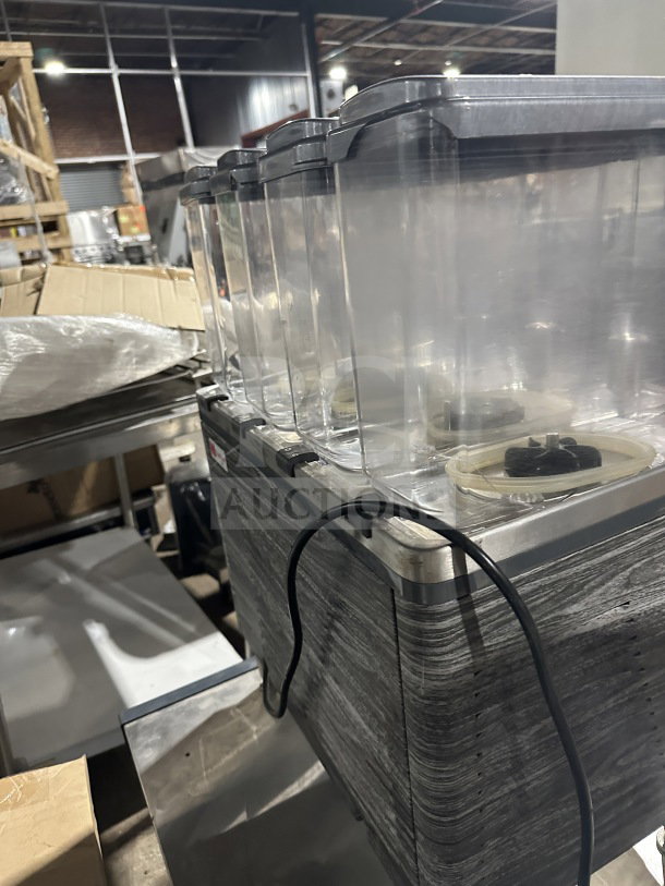 2019 Crathco commercial beverage dispenser, 4 clear poly hoppers, stainless steel body, model CS4E/2D/3D16, on legs.