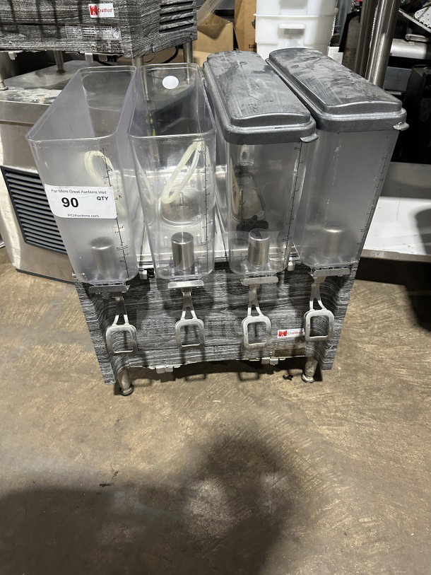 2019 Crathco CS4E/2D/3D16 beverage dispenser with four clear poly jugs, stainless steel body, and legs. Model SN: T458109.