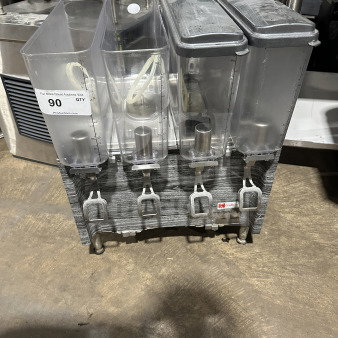 2019 Crathco CS4E/2D/3D16 beverage dispenser with four clear poly jugs, stainless steel body, and legs. Model SN: T458109.