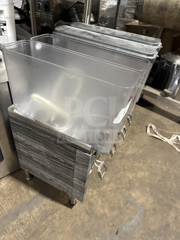 Crathco 2019 countertop beverage dispenser, model CS4E/2D/3D16. Features four clear poly jugs, stainless steel body, and sturdy legs.