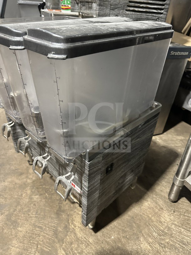 2019 Crathco CS4E/2D/3D16 beverage dispenser, 4 clear poly jugs, stainless steel body, on legs, model SN: T458109, 120V.