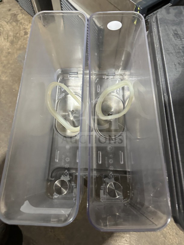 Crathco 2019 CS4E/2D/3D16 beverage dispenser, features 4 clear poly jugs, stainless steel body, in good condition.