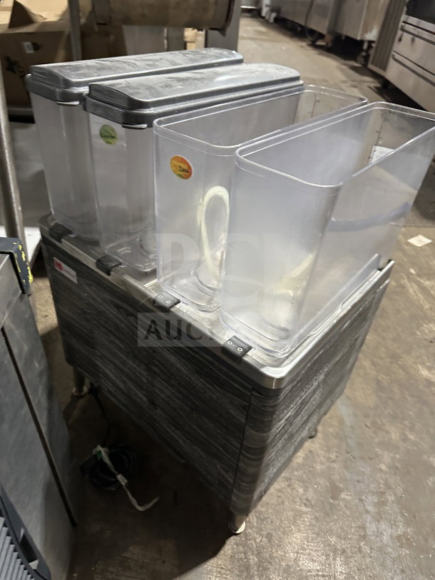 2019 Crathco CS4E/2D/3D16 beverage dispenser, 4 clear poly jugs, stainless steel body, on legs, excellent condition.
