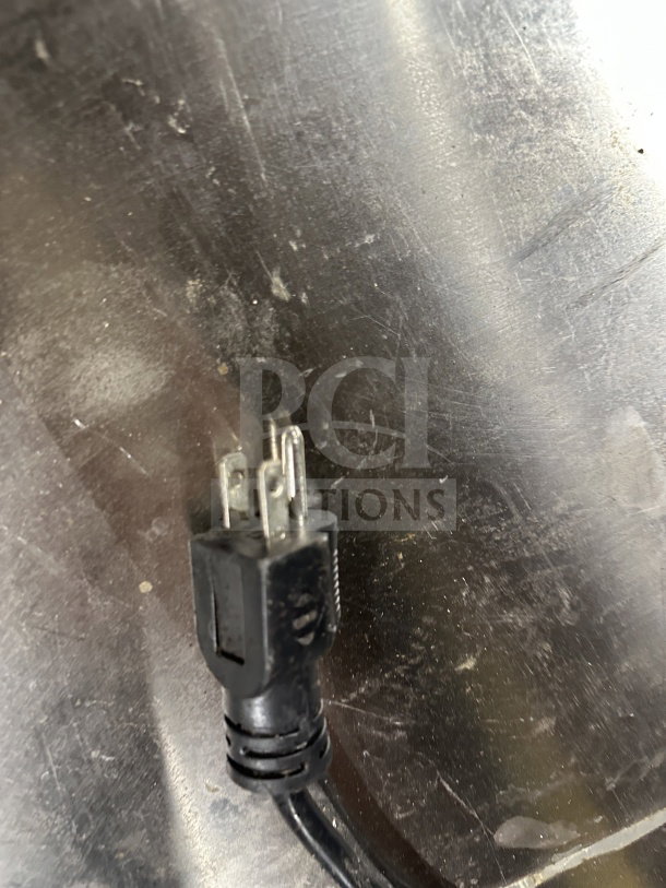 Power plug for Manitowoc 20" Undercounter Nugget Ice Machine, Model UNP0200A-161. Stainless steel surface visible.