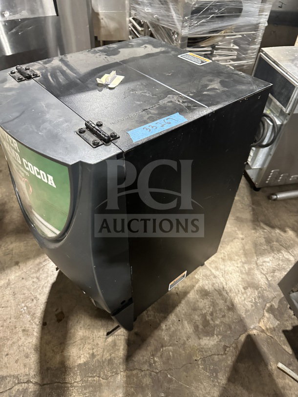 Bunn IMIX5S commercial beverage dispenser, black, 120V, 1 Phase. Visible labels and hinged panel, used condition.