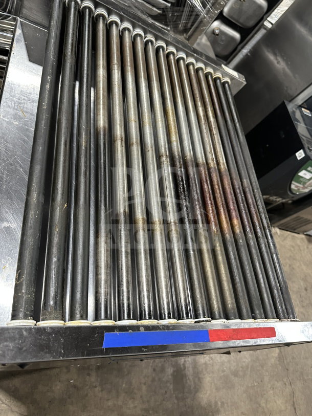 Standex APW Wyott HRS-755T stainless steel hot dog roller grill, 208/240V, visible wear on rollers, serial SN: 817961607117.