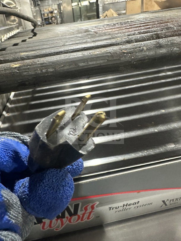Standex APW Wyott HRS-755T stainless steel hot dog roller grill, 208/240V, shown with plug, used condition.