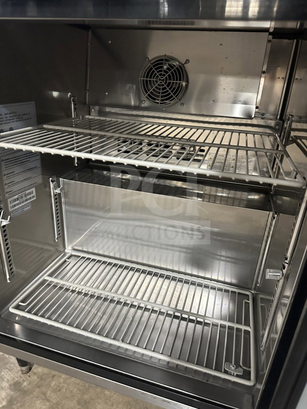 Turbo-Air stainless steel undercounter refrigerator, Model MUR-28-N-711S, with poly-coated wire rack, 115V, on legs.