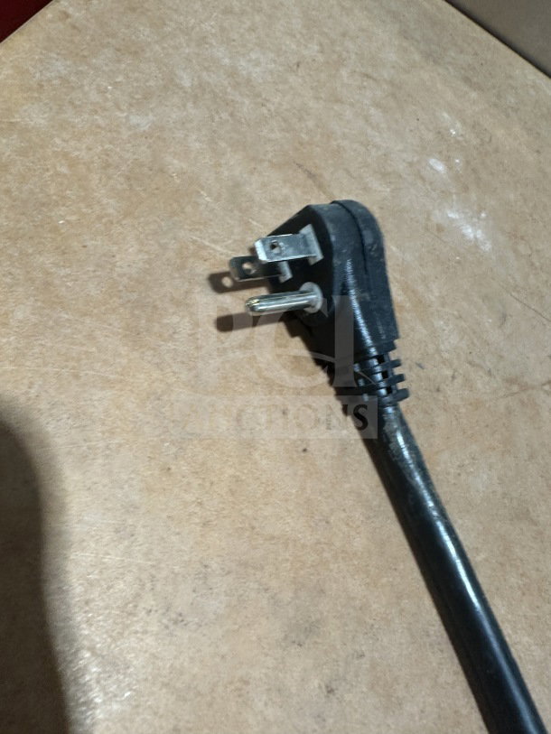 Alt text: Turbo-Air undercounter refrigerator power plug, Model MUR-28-N-711S, SN H2MU2R0G63826, 115V, on legs.