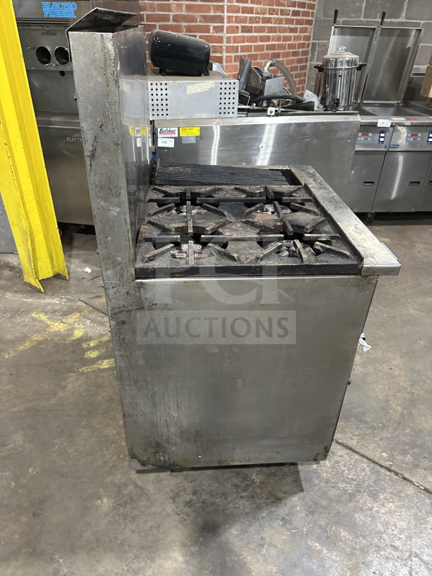 Commercial stainless steel gas range with 4 open burners, 12" charbroiler, standard oven base, wired rack, on legs.