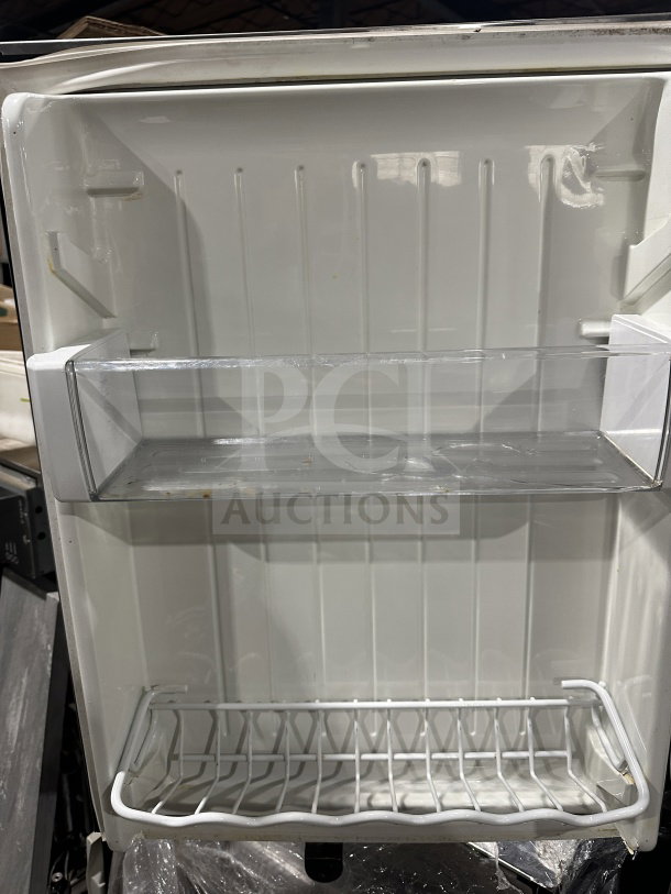 KitchenAid Commercial Stainless-Steel Countertop Refrigerator, Model KURS24LSB03, open view showing interior door shelves.
