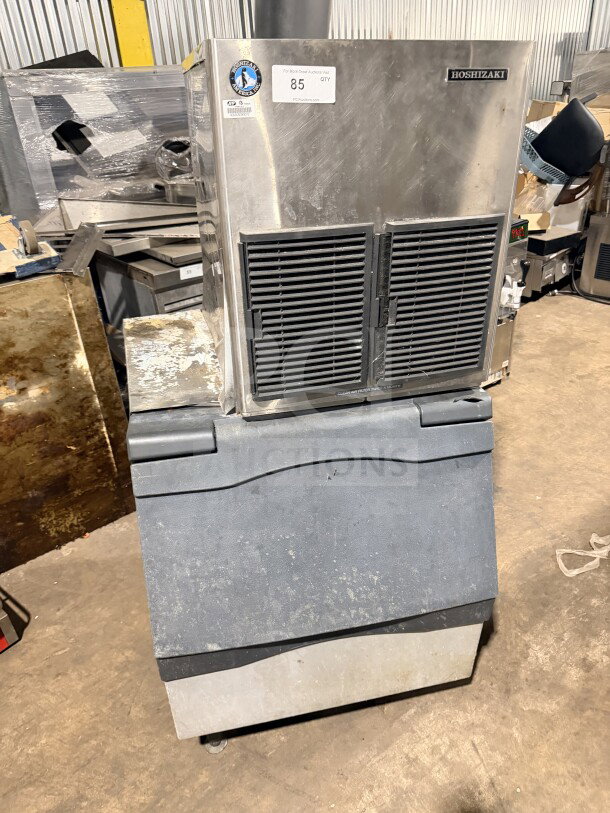 Hoshizaki stainless steel 22" air-cooled modular flake ice machine, Model F-1001MAH, with insulated storage bin, auction tag visible.