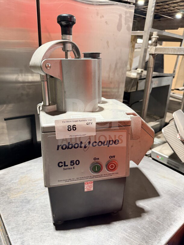 Robot Coupe CL50 commercial stainless steel countertop food processor, used condition, without discs, model and control markings visible.