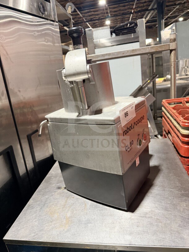 Robot Coupe CL50 commercial stainless steel food processor, countertop model, no discs, used condition, label visible.