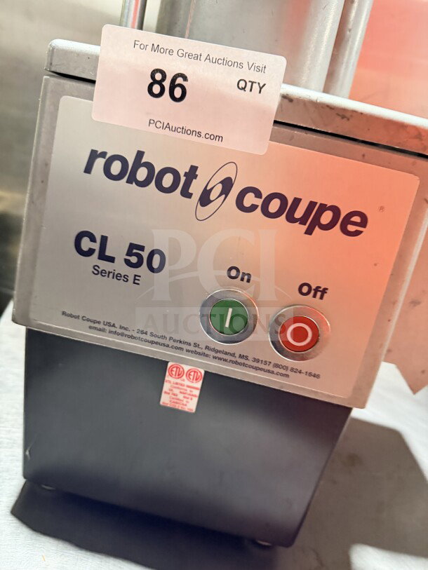 Robot Coupe CL50 commercial food processor, stainless steel, lacks discs. Features on/off buttons. Auction ID tag visible.