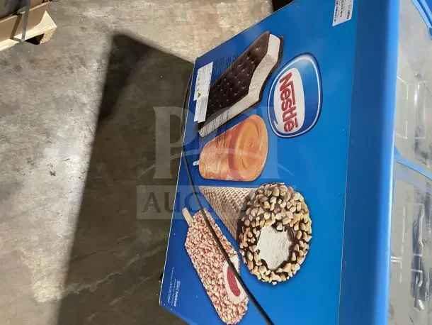 AHT RIO S100 ice cream display freezer, model RIO S100, serial 60126900002147, on casters, 115V 1 phase, Nestle branding.