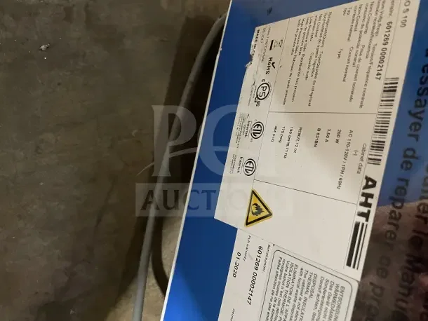 AHT RIO S100 ice cream display freezer, 115V, with labels showing model and serial number. On casters, working condition.