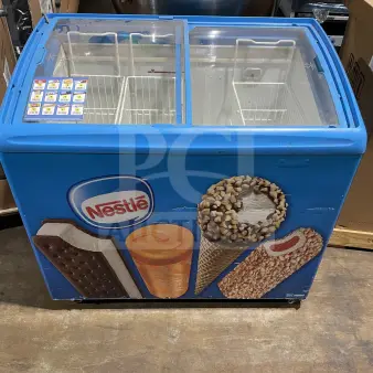 AHT Commercial Ice Cream Display Freezer, Model RIO S100, 115V 1 Phase, on casters, with Nestle branding, in working condition.