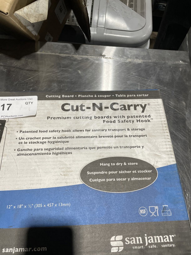 San Jamar Cut-N-Carry cutting board set, model CB1218KC, 12"x18", assorted colors, patented safety hook, new condition.