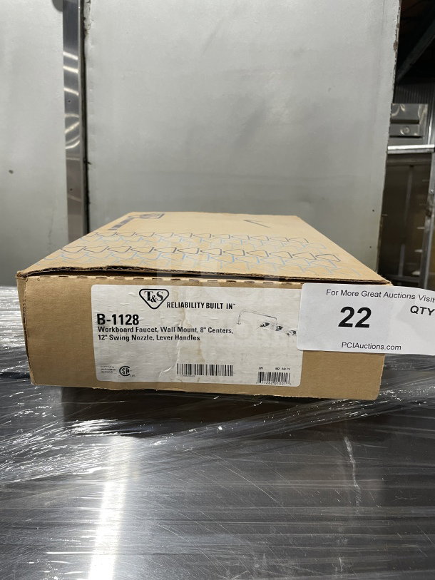 T&S Commercial Heavy-Duty Wall-Mounted Workboard Faucet, Model B-1128, in original packaging. Features 8" centers, 12" swing nozzle, lever handles. Box labeled with product details.